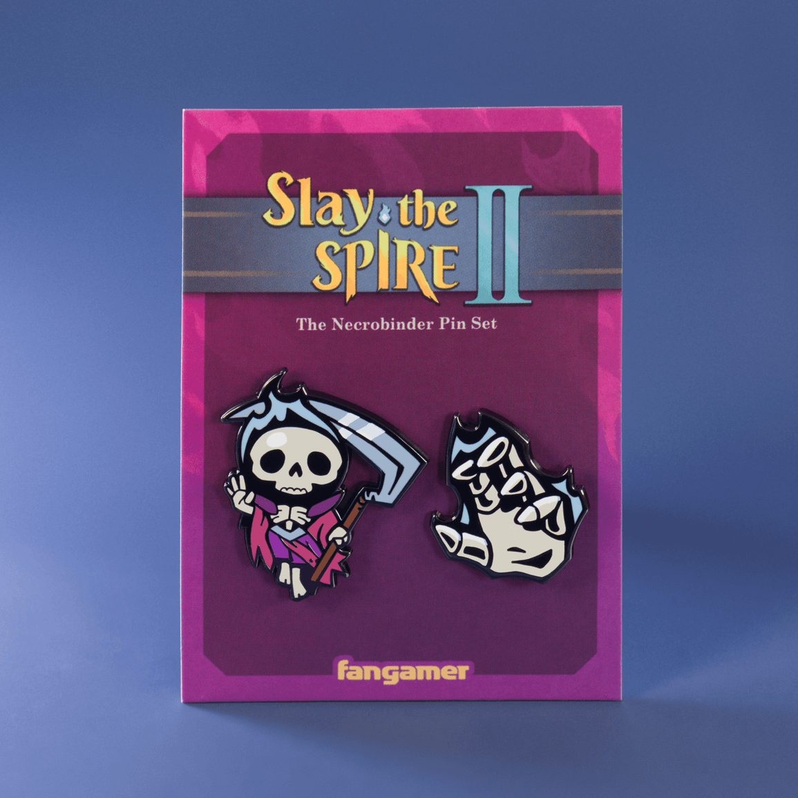 Pin set packaging for 'Slay the Spire II' with two skeleton-themed pins on a purple background.